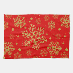 Golden snowflakes on red tea towel