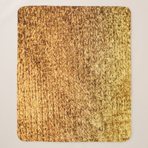 Golden textile: glamourous macro background. sherpa blanket