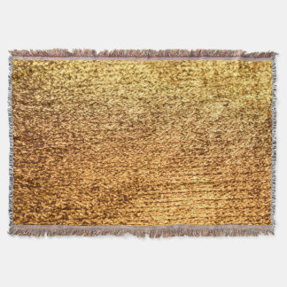 Golden textile: glamourous macro background. throw blanket