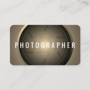 Golden tone camera lens business card
