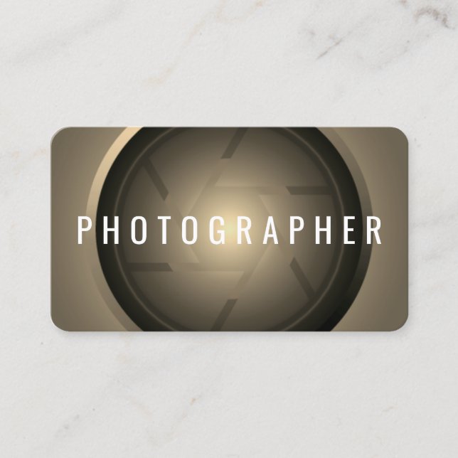 Golden tone camera lens business card (Front)