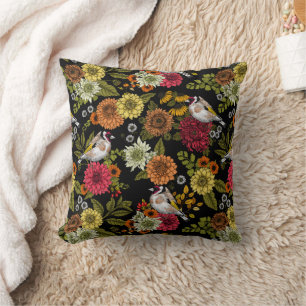 Goldfinches in the garden on black cushion