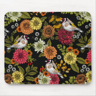 Goldfinches in the garden on black mouse mat