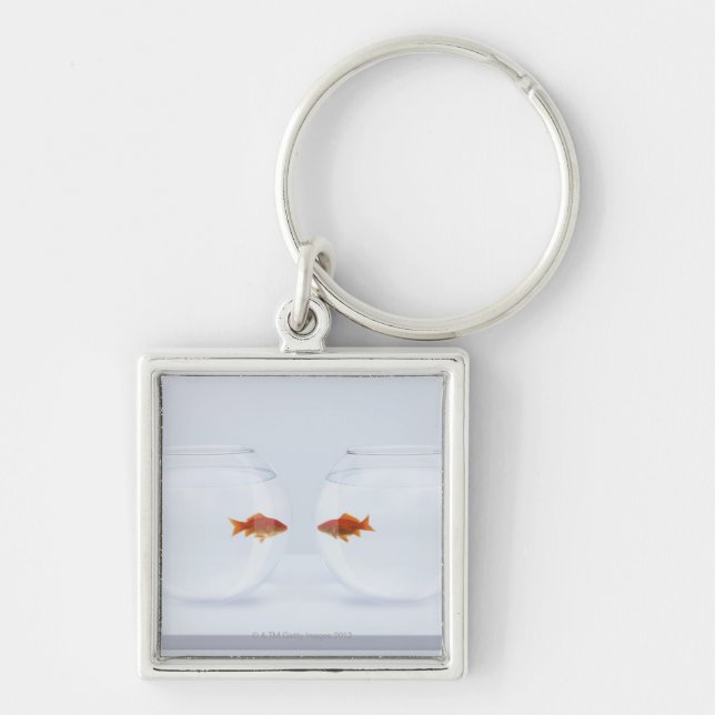 Goldfish in separate fishbowls looking face to fac key ring (Front)