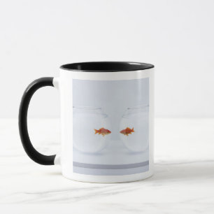 Goldfish in separate fishbowls looking face to fac mug