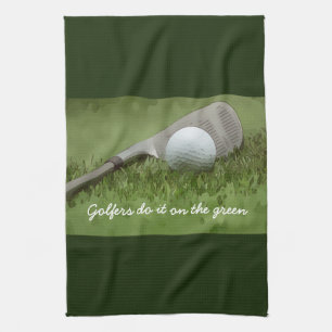 Golf ball and sand wedge golfers do it on green tea towel