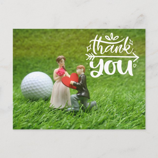Golf ball and tee are on green grass  Wedding Postcard (Front)