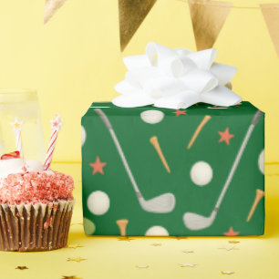 Golf ball and tee for golfer on green wrapping paper