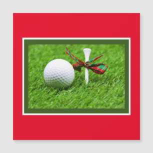 Golf ball Christmas with tee on green grass