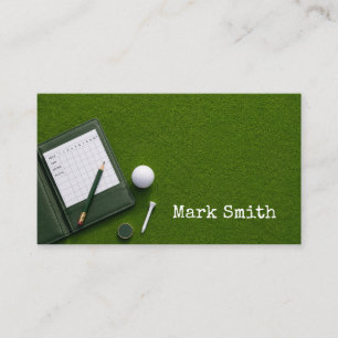 Golf ball is in the hole on green with name business card