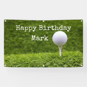 Golf ball is on tee on green grass background banner