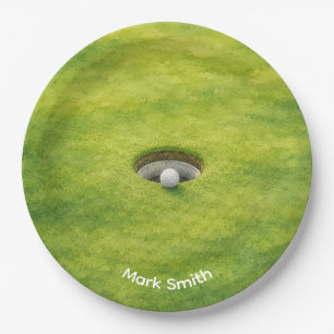 Golf Ball Next to Hole on Green Grass Golf Course Paper Plate