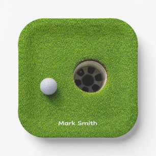 Golf Ball Next to Hole on Green Grass Golf Course Paper Plate