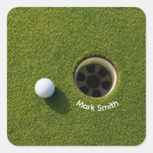 Golf Ball Next to Hole on Green Grass Golf Course