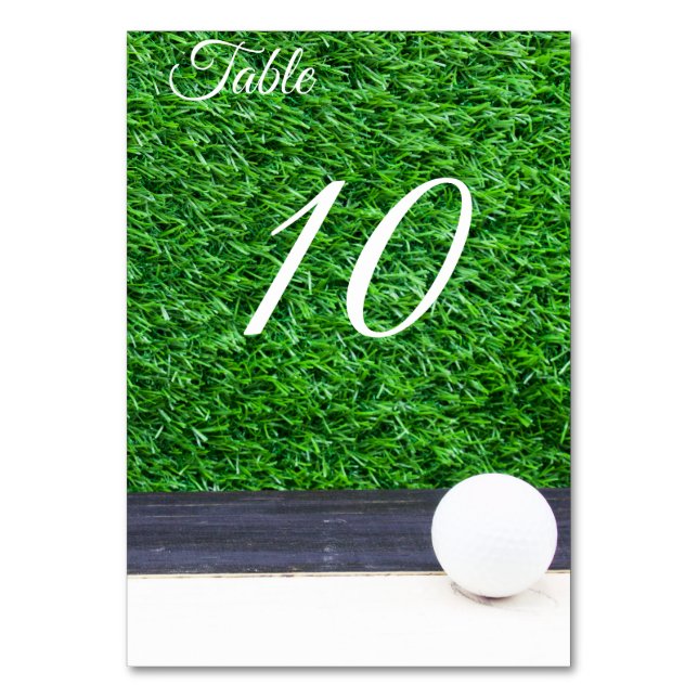 Golf ball on green grass table number (Front)