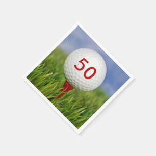golf ball on red tee napkin