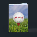 Golf Ball On Tee for Grandson Card<br><div class="desc">Close up of golf ball on red tee in green grass for Grandson's birthday.
Text on ball can be edited.</div>