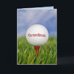 Golf Ball On Tee for Grandson's Birthday Card<br><div class="desc">Close up of golf ball on red tee in green grass for Grandson's birthday.
Text on ball can be edited.</div>