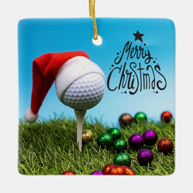 Golf ball on  tee with Santa hat for Christmas  Ceramic Ornament (Front)