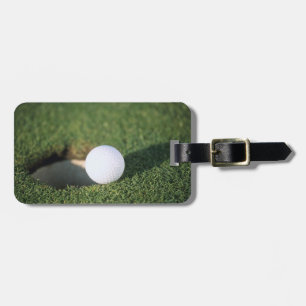 Golf Ball on the edge of hole Luggage Tag