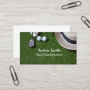 Golf ball shoe putter on green golfer business car business card