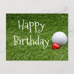 Golf ball with heart are on green grass postcard