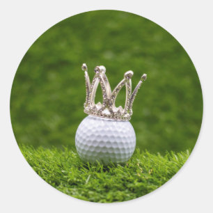 Golf ball  with silver crown are on green grass  classic round sticker