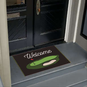 Golf  ball with tee on green grass   doormat