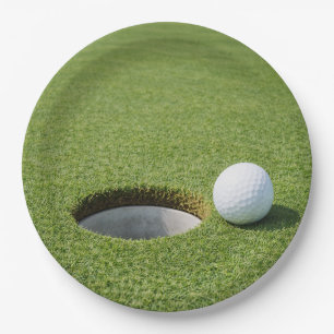 Golf ball with tee on green grass golfer party paper plate