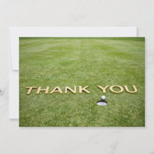 Golf ball with text Thank you on green grass Card