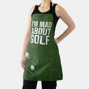 Golf Balls are on green grass mad about golf Apron