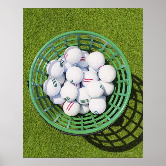 Golf balls in a basket sitting on short green poster (Front)