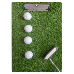 Golf balls on green grass for golfer clipboard