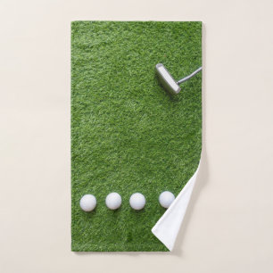 Golf balls with Putter are on green grass  Hand Towel