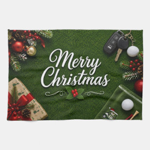 Golf Christmas themed on green grass Tea Towel