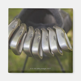 Golf club heads in a bag. Three through nine Magnet