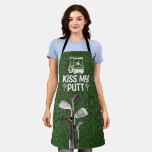 Golf Clubs are on green grass Apron