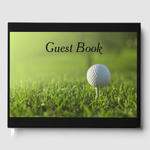 Golf Guest book with golf ball on tee on green 