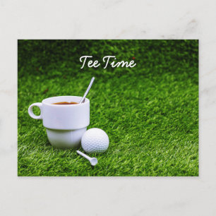 Golf tee time with cup of tea on green grass postcard