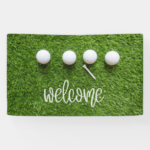 Golf welcome sign with golf ball on green grass