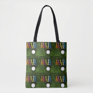 Golf with colourful tees are on green gras tote bag