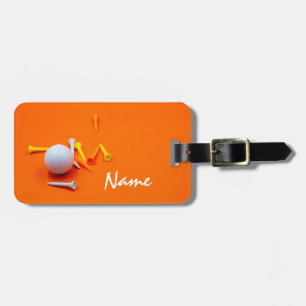 Golfer bag tag with golf ball and tees on orange