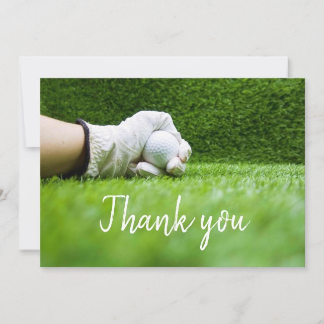 Golfer is holding golf ball on green grass thank you card (Front)