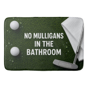 Golfer's bathroom with golf balls and putter bath mat