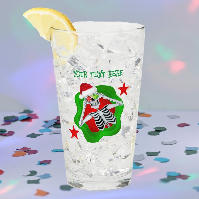 Goofy Christmas Skeleton Ornament Eyes in Splatter Glass (Silly skeleton ornament eyes splatter shape red stars on Merry Christmas glass drink tumbler.)