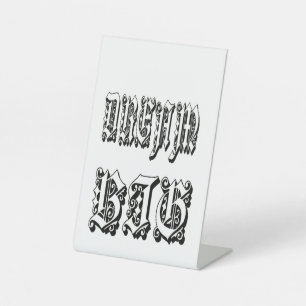gothic blackletter typography pedestal sign