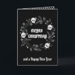 Gothic Christmas Wreath Holiday Card<br><div class="desc">This Gothic Christmas Wreath With Skulls card features a lovely Christmas wreath decorated with playful skulls against a black background. Customise with your greeting on the front and add a special message inside.</div>