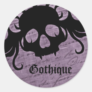 Gothic purple and black fanged skull classic round sticker
