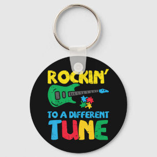 Grab this cute Rockin To Different Tune Guitar T-S Key Ring