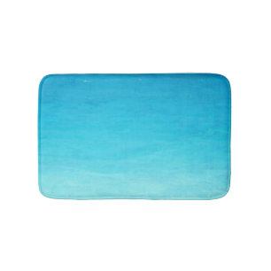 Graduated blue water on a bath mat